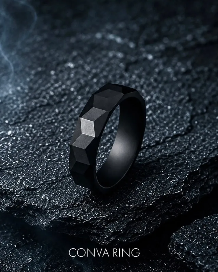 Black Mamba Conva ring with faceted geometric surface on dark rock