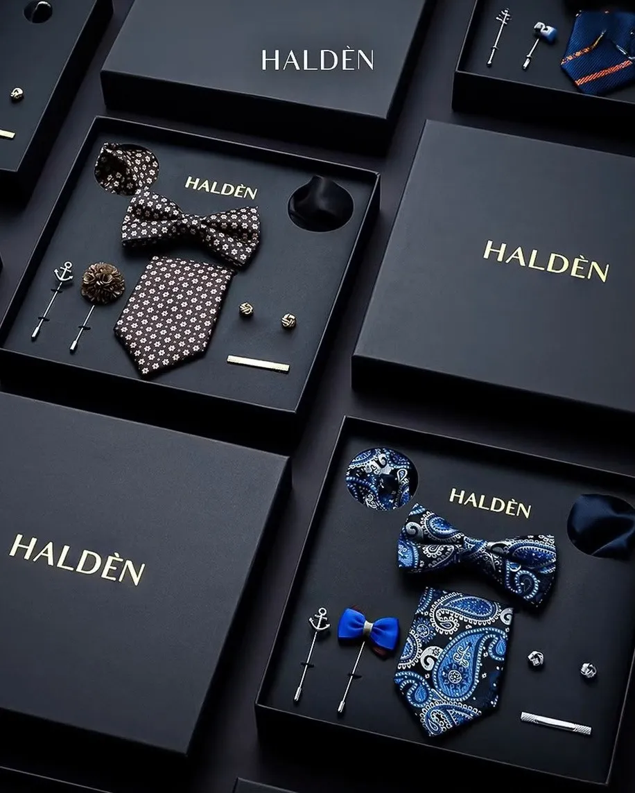 Halden gift boxes with patterned ties, bow ties, cufflinks and lapel pins on black